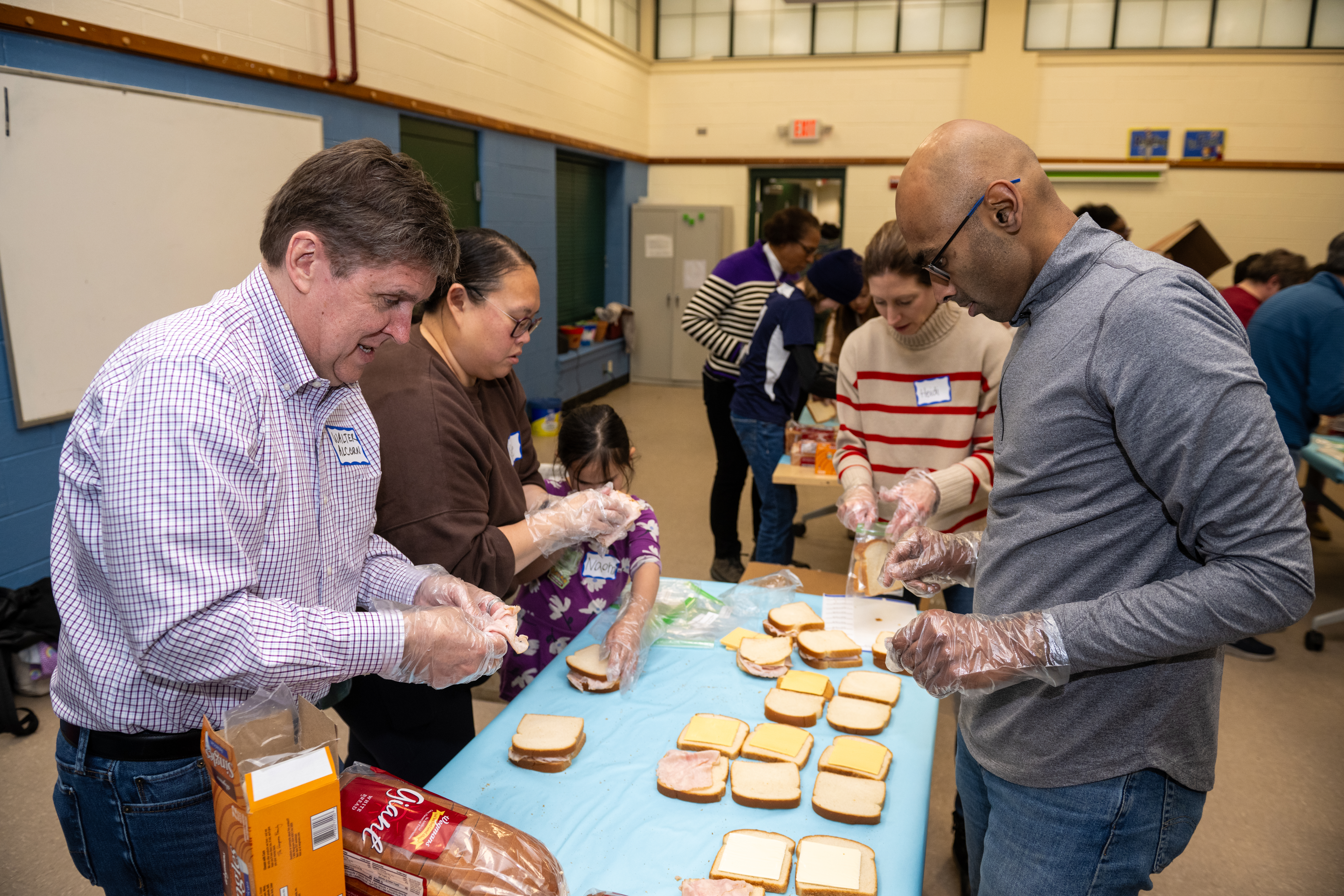 Volunteers preparing sandwiches during a community service project at Reston Community Center.