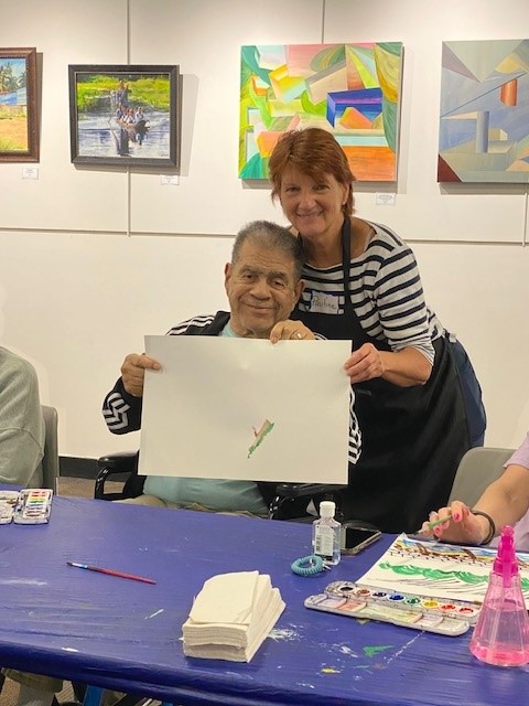 Pauline Daniels, RCC’s Unforgettable facilitator, celebrates a participant’s artistic expression.